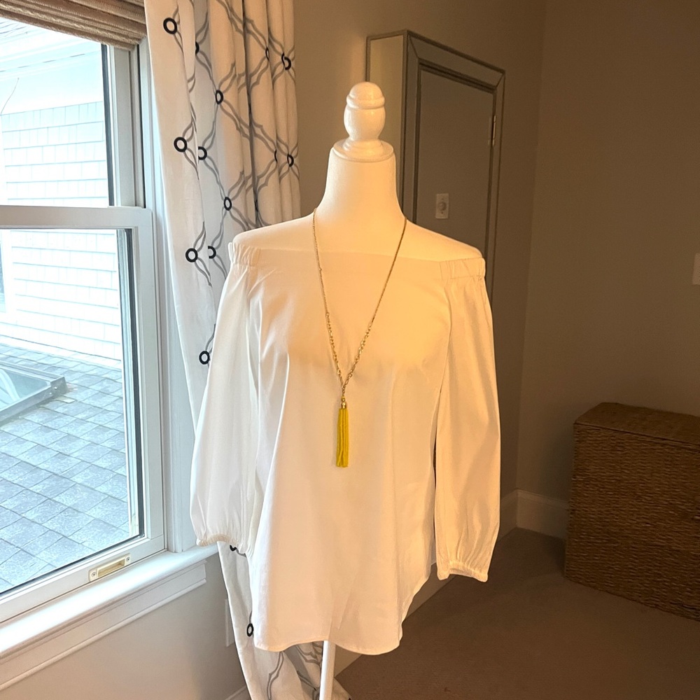 White House Black Market white blouse. Long sleeve, sits on shoulders. NWT